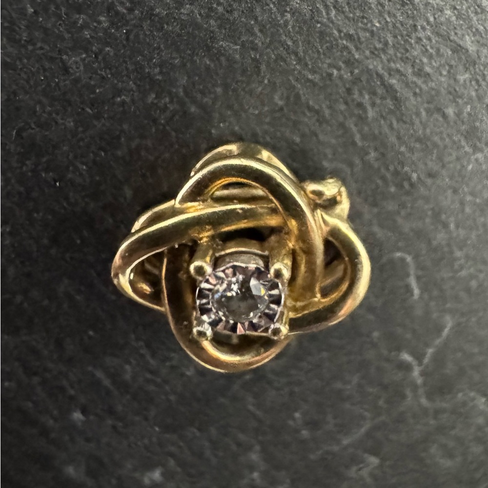 Gold charm with diamond center